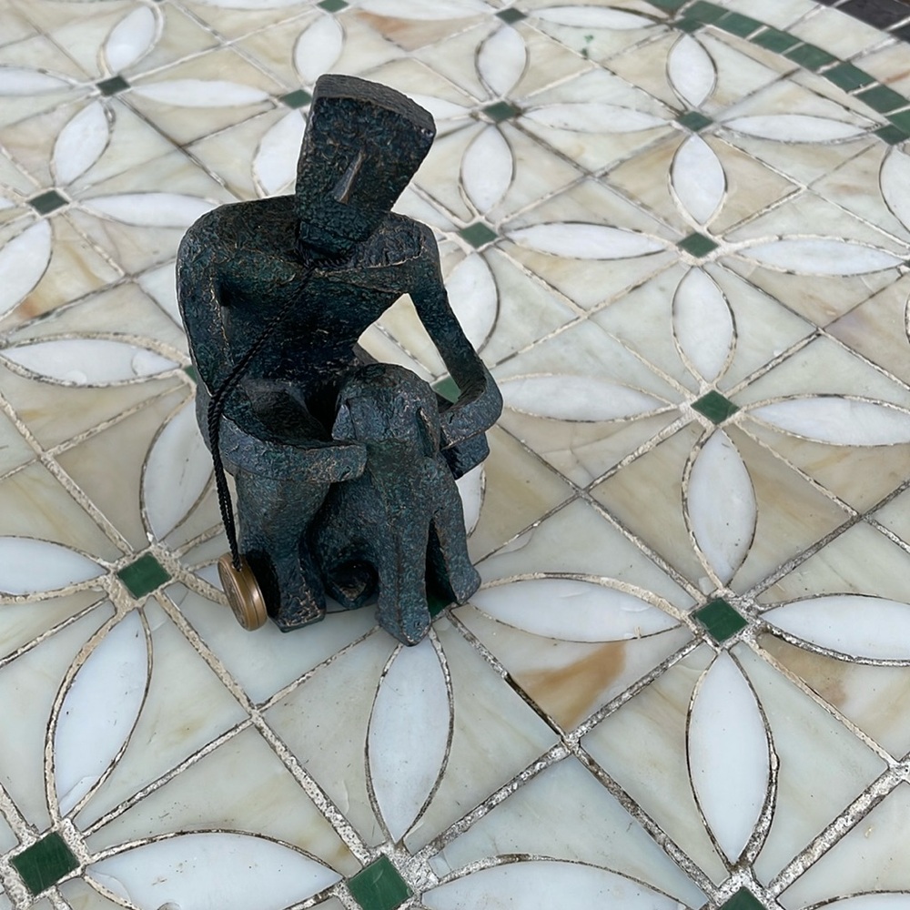 Man figure with dog